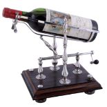 A silver mechanical wine decanting cradle by Neil David Bollen, London 1982  A silver mechanical