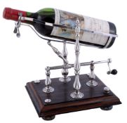 A silver mechanical wine decanting cradle by Neil David Bollen, London 1982  A silver mechanical