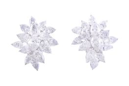 A pair of diamond ear clips, set with a cluster of pear shaped diamonds  A pair of diamond ear