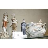 A pair of Royal Dux male and female figures,   a Royal Dux centrepiece and a figure the' Priory of