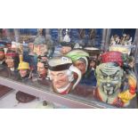 A quantity of Royal Doulton and a Carlton ware character jugs,   various sizes, mainly large, to