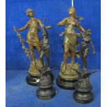 Two 19th Century pairs of spelter figures  , on circular plinth bases, 39cm and 35cm high