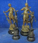 Two 19th Century pairs of spelter figures  , on circular plinth bases, 39cm and 35cm high