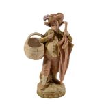 A Royal Dux figure of a boy,   in typical gilt and colours, with an oversized umbrella and basket,