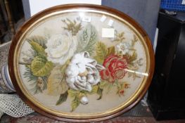 A Victorian beadwork and tapestry work oval floral picture within a rosewood frame
