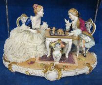 German porcelain figure group,   playing chess, marked Unter Weiss Bach to base, 45cm wide