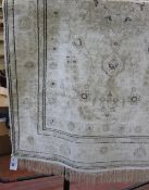 A Tabriz cream silk rug,   163 x 96cm.