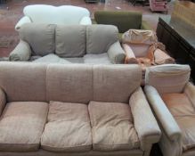 A pair of upholstered armchairs, two three seater sofas, and two further sofas and a sideboard etc