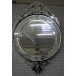 A Venetian style circular mirror   with scrolled crest and base.120cm x 76cm.