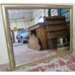 A gold framed hall mirror   with bevelled plate. 138cm x 108cm.