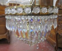 A 20th Century Swarovski style two tier brass and cut glass lustre chandelier   (af)