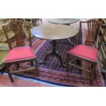 A Georgian style mahogany snap top table   on tripod base and two Hepplewhite style chairs.