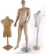 A composition male mannequin with detachable limbs on a metal stand;   together with a  clear