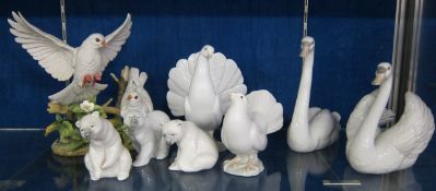 A quantity of Lladro   to include two doves, two swans and three polar bears; and another
