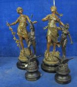 Two 19th Century pairs of spelter figures  , on circular plinth bases, 39cm and 35cm high