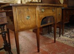 A George III mahogany bowfronted sideboard  , circa 1790, with central drawer and tambour slide