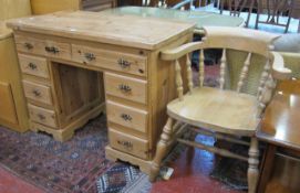 A pine kneehole desk   and a bow back desk chair.