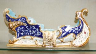 A majolica sleigh shaped centrepiece   marked W.S.  &  S to inside (af), 46cm long