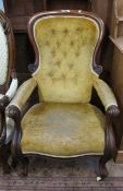 A Victorian mahogany armchair   with button back upholstery