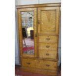 An Edwardian satin walnut compactum   with fitted interior over a row of drawers and hanging space.