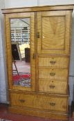 An Edwardian satin walnut compactum   with fitted interior over a row of drawers and hanging space.