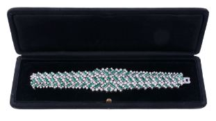 An emerald and diamond bracelet, circa 1960  An emerald and diamond bracelet,   circa 1960,    the