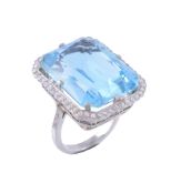An aquamarine and diamond dress ring , the rectangular mixed cut aquamarine...  An aquamarine and