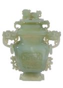 A large Chinese jade vase and cover, 20th century,   with Buddhistic lion finial and handles, 24.