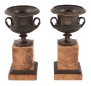 A pair of Louis Philippe patinated bronze and marble mounted urns,   circa 1830, each of Campana