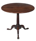 A George II mahogany tripod table,   circa 1750, the circular top with turned barrel stem above