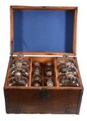 A Low Countries oak and iron-bound travelling set of glass spirit decanters,   first half 18th