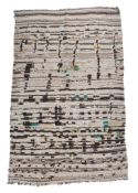 A Moroccan rug, approximately 210 x 118cm Please note that the image captions for these lots have