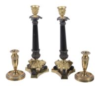 A pair of patinated and gilt metal candlesticks in Restauration style,   second half 20th century,