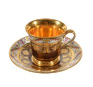 A Paris porcelain (La Courtille) mottled cafe-au-lait ground and gilt coffee cup and saaucer,