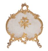 A Victorian brass and mesh firescreen in Rococo revival taste  , circa 1880, of cartouche form with