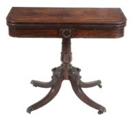 A late Regency mahogany folding card table  , circa 1820, the rectangular rosewood banded top with