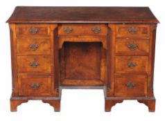 A walnut and crossbanded desk, in George II style,   late 19th/ early 20th century, with false
