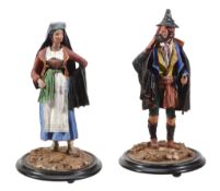 A pair of Victorian polychrome painted papier mache models of a southern European couple,   late