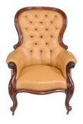 A Victorian mahogany and leather upholstered library chair  , circa 1860, the button upholstered