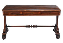 A William IV rosewood library table  , circa 1835, the rectangular top with rounded corners above