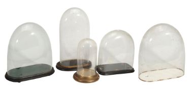 Five various glass mantel clock domes,   probably French, 19th century