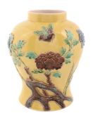 A Chinese yellow-ground vase, 20th century,   applied with flowers and birds glazed in green, blue