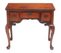 A mahogany side table in George II style,   18th century and later elements, the rectangular top