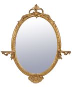 A Victorian carved and composition oval wall mirror , circa 1870, the plate within a foliate