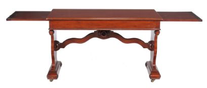 A Victorian mahogany library table, circa 1850, the rectangular top with moulded edge, fitted a
