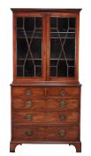 A George III mahogany cabinet on chest  , circa 1780, the moulded cornice above a pair of astragal