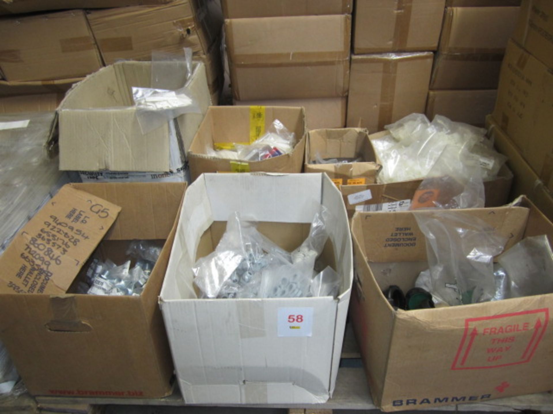 Pallet of assorted fittings including Conduit reduces, cable cleats, nylon clips, nylon nuts, hose