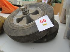 Two solid wheelbarrow wheels