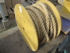 Tug of war rope on large cable reel