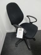 Black upholstered swivel armchair with gas lift. Located at Unit 1, Neptune Court, Barton Manor,